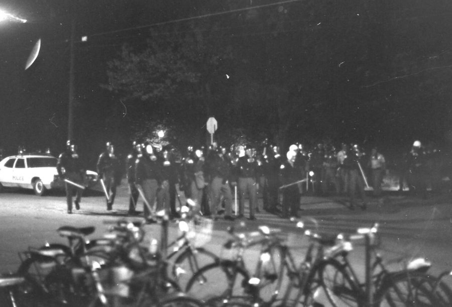 Police watch the student Peace March Protest with batons in their hands in the fall of 1971 in Carbondale, Ill. 