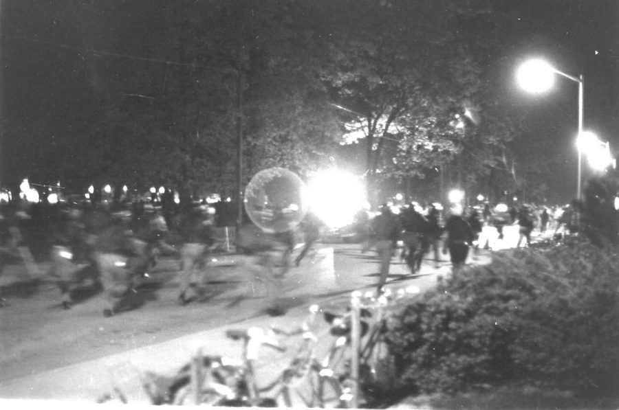 Police charge forward with batons at SIU students during the Peace March Protest in the fall of 1971 in Carbondale, Ill. 
