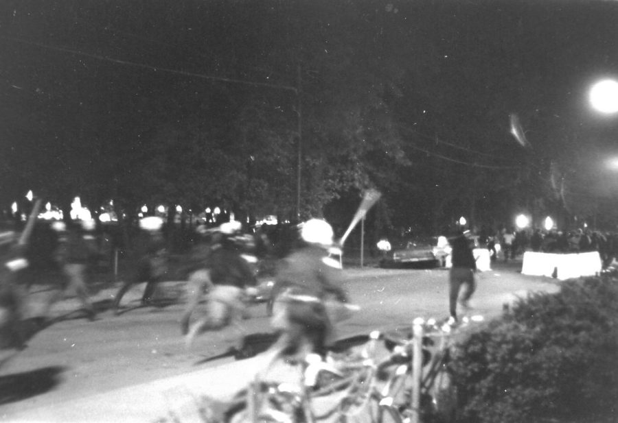 Police run towards SIU students during the Peace March Protest against the Vietnam War in the fall of 1971 in Carbondale, Ill. 