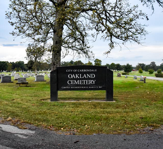 A sign at the Oakland Cemetery marks the entrance of the supposedly haunted cemetery Oct 15, 2021 in Carbondale, Ill. 