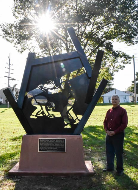 The maker of the Memorial Monument stands next to his monument after the event at Attucks Park on Sunday Oct. 17, 2021 in Carbondale Ill.
