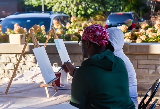 Two students paint at the Paint & Sip hosted by the Black Affairs Council in the Student Services Building Pavilion at SIU Oct. 20, 2021 in Carbondale, Ill.