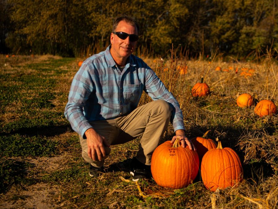 SIU professor, Alan Walters, poses for a photo in the pumpkin fields at the Horticulture Farm on Monday, Nov. 8, 2021. Dr. Walters, who is a professor of Vegetable Science and Breeding in the Department of Plant, Soil and Agricultural Systems, is researching how to get pumpkins to grow bigger in hotter climates. 