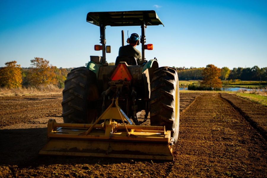 A tractor plows the field in preparations for next planting season for pumpkins at the Horticulture Farm on Monday, Nov. 8, 2021.  
