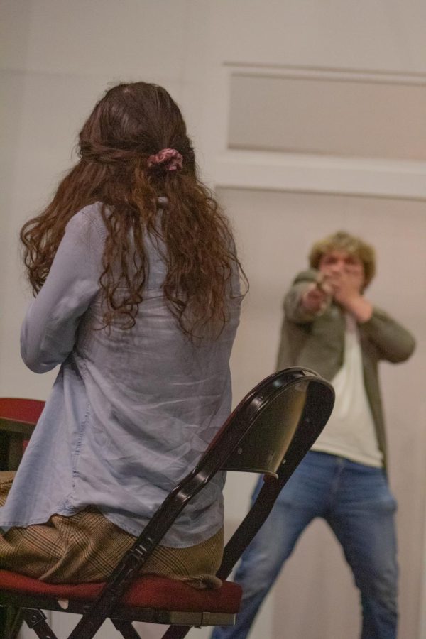 Jackie Coryton (left) and Mitchell Brandon rehearse for the play, “Hay Fever,” at the McLeod Theater Nov. 11, 2021 at SIU in Carbondale, Illinois. “The family that plays together, stays together,” Director Rion Towery said. 
