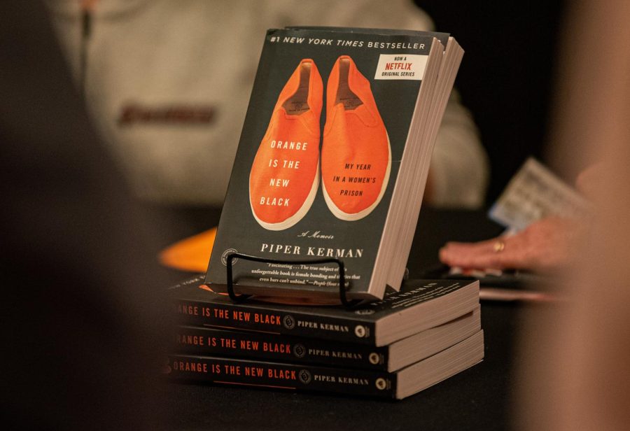 Copies of Orange is the New Black, sit on display for sale outside of Shryock Auditorium before Piper Kerman lecture Thursday, Nov. 4, 2021 at Shryock Auditorium at SIU. Kerman, 