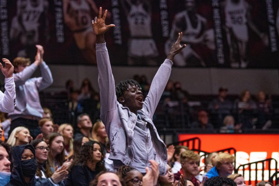 A fan sitting in the Dawg Pound, celebrates after a scoring play from the Salukis during SIUs 73-55 win over Austin Peay during the Charles Helleny Tip-Off Classic on Friday, Nov. 12, 2021 at the Banterra Center at SIU. 