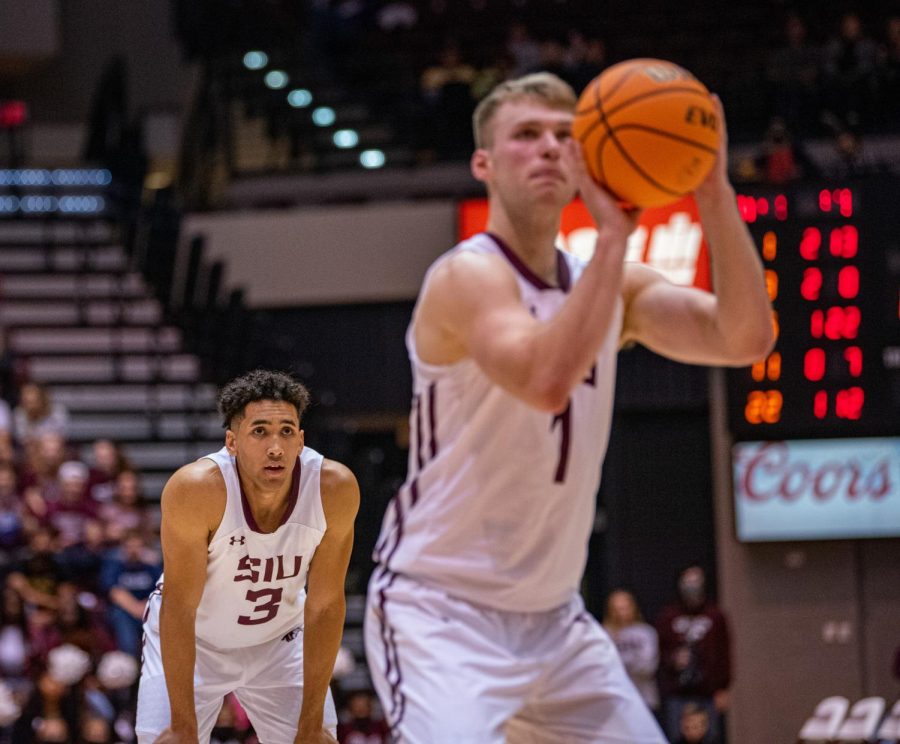 SIU guard Dalton Banks, left, watches teammate Marcus Domask shoot a free throw attempt during SIUs 73-55 win over Austin Peay during the Charles Helleny Tip-Off Classic on Friday, Nov. 12, 2021 at the Banterra Center at SIU. 
