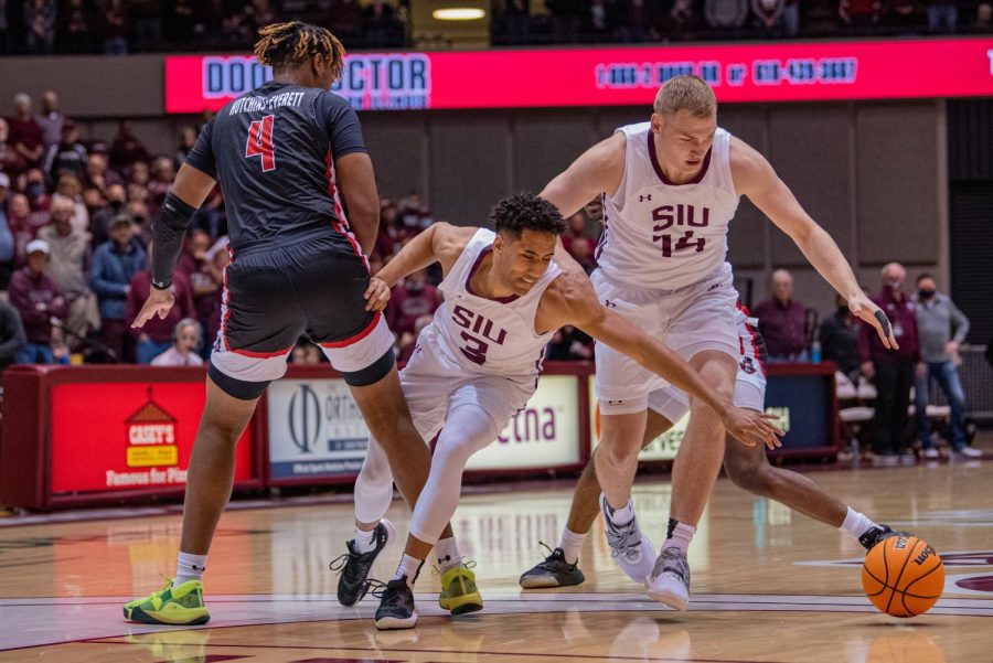 SIU guard, Dalton Banks, gets tangled up and looses the ball during a drive that would be a turnover for the Salukis during SIUs 73-55 win over Austin Peay during the Charles Helleny Tip-Off Classic on Friday, Nov. 12, 2021 at the Banterra Center at SIU. 