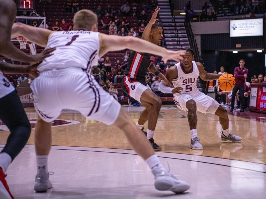 SIU guard, Lance Jones, drives the ball while looking to pass to teammate Marcus Domask during SIUs 73-55 win over Austin Peay during the Charles Helleny Tip-Off Classic on Friday, Nov. 12, 2021 at the Banterra Center at SIU. 