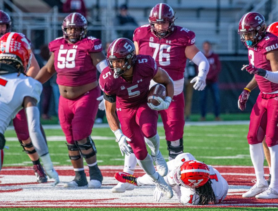 Running back, Justin Strong, breaks a tackle during SIUs 18-35 loss vs. Youngstown State during Senior Day. Strong would rush for 107 yards on Saturday, Nov. 20, 2021 at Saluki Stadium at SIU.  