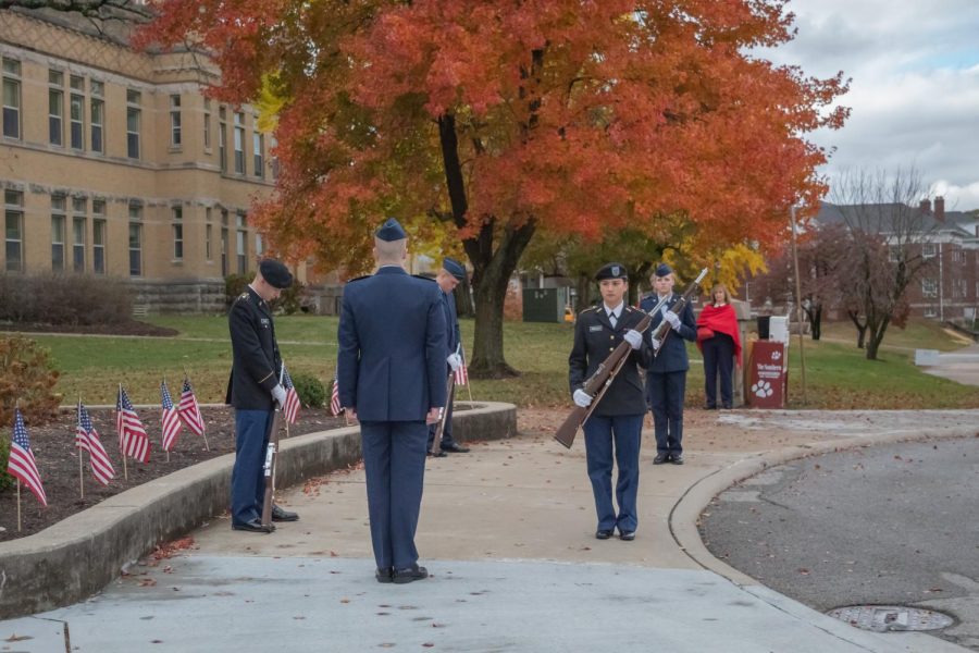 ROTC+students+switch+out+for+15+minute+shifts+at+the+Veteran+Day+silent+vigil+Nov.+11%2C+2021+at+SIU+in+Carbondale%2C+Illinois.+%E2%80%9CBasically%2C+we+have+guards+standing+out+and+sitting+in+front+of+the+US+flag.+As+well+as+a+wreath+that+we+have%2C+which+represents+all+branches+of+the+military+as+well+as+prisoners+of+war+and+those+missing+in+action+presented+by+our+POW+MIA+flag%2C%E2%80%9D+fourth+year+cadet%2C+Rebecca+Singer+from+Airforce+ROTC%2C+said.+%0A
