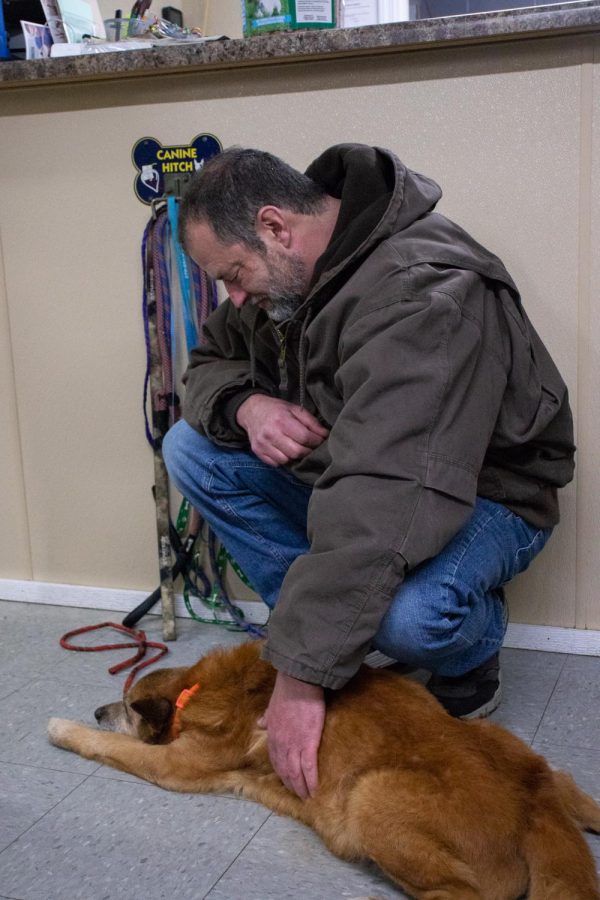 John Hoback pets his dog Kye after being reunited Dec. 18, 2021 at the Mayfield-Graves County Animal Shelter in Mayfield, Kentucky. 