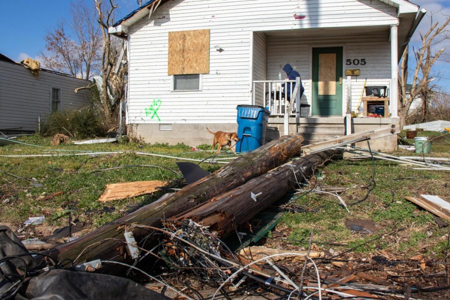 A downed power line remains in Sarah Bryans front lawn Dec. 18, 2021 in Mayfield, Kentucky. 