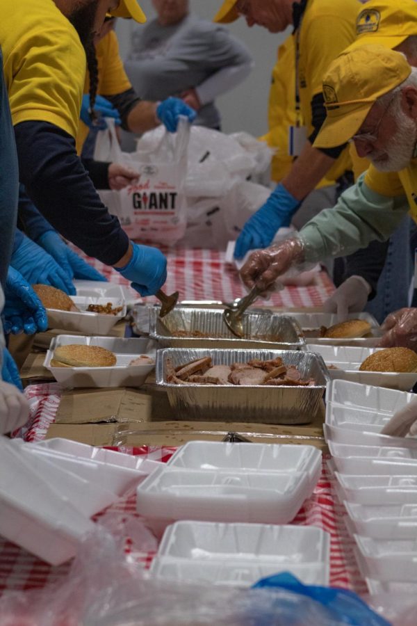 Volunteers from the Southern Baptist Disaster Relief prepare food plates to give to those left in need due to the Dec. 10 tornado at High Point Baptist Church Dec. 18, 2021 in Mayfield, Kentucky.