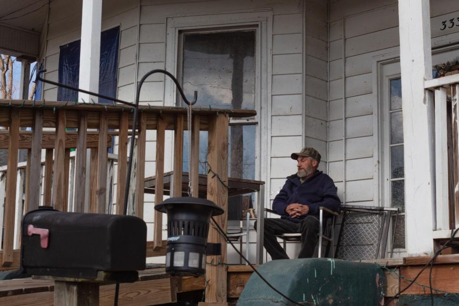 Jeff Oglesdee sits outside on a porch Dec. 19, 2021 in Mayfield, Kentucky. 
