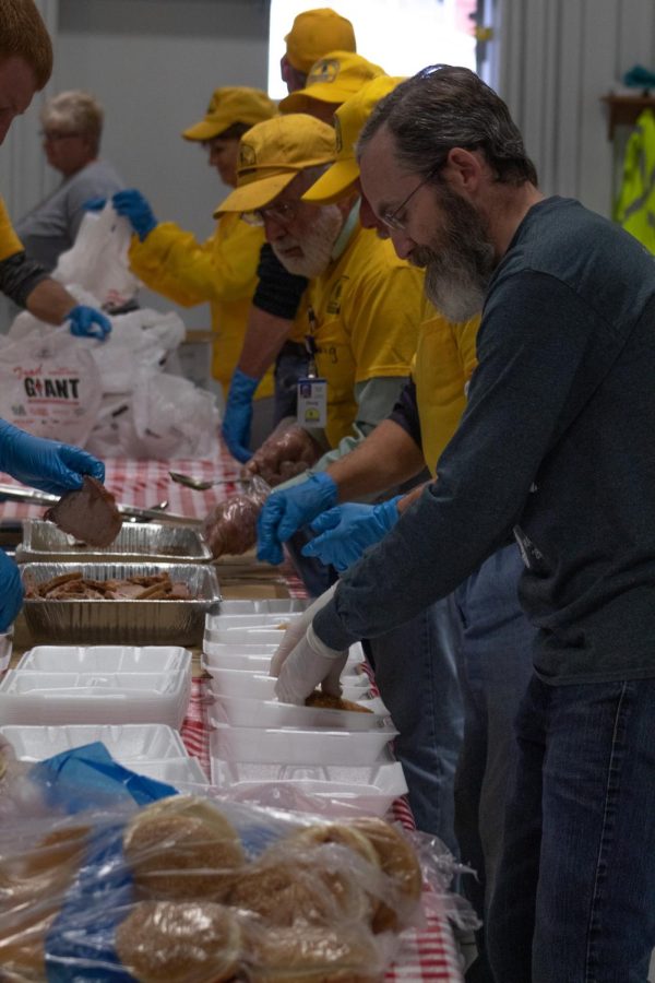 Volunteers from the Southern Baptist Disaster Relief prepare plates of food to give to tornado survivors Dec. 18, 2021 at High Point Baptist Church in Mayfield, Kentucky.
