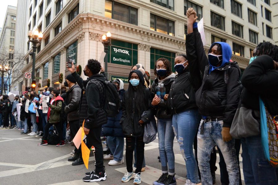 Protestors lock arms and take selfies at a rally criticizing Chicago Public Schools (CPS) COVID-19 pandemic safety response on January 14, 2022 in Chicago, Ill.
