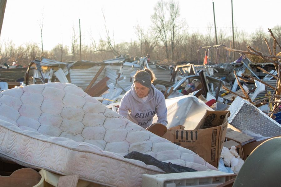 Cheryl Vincent searches through the rubble of her tornado-damaged storage unit in search of lost belongings Dec. 19, 2021 in Dawson Springs, Kentucky. 