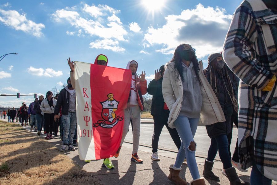 Kappa Alpha Psi members hold the fraternity banner during the Alpha Phi Alpha Fraternity Inc. MLK Day March Jan. 17, 2022 in Carbondale, Ill. 