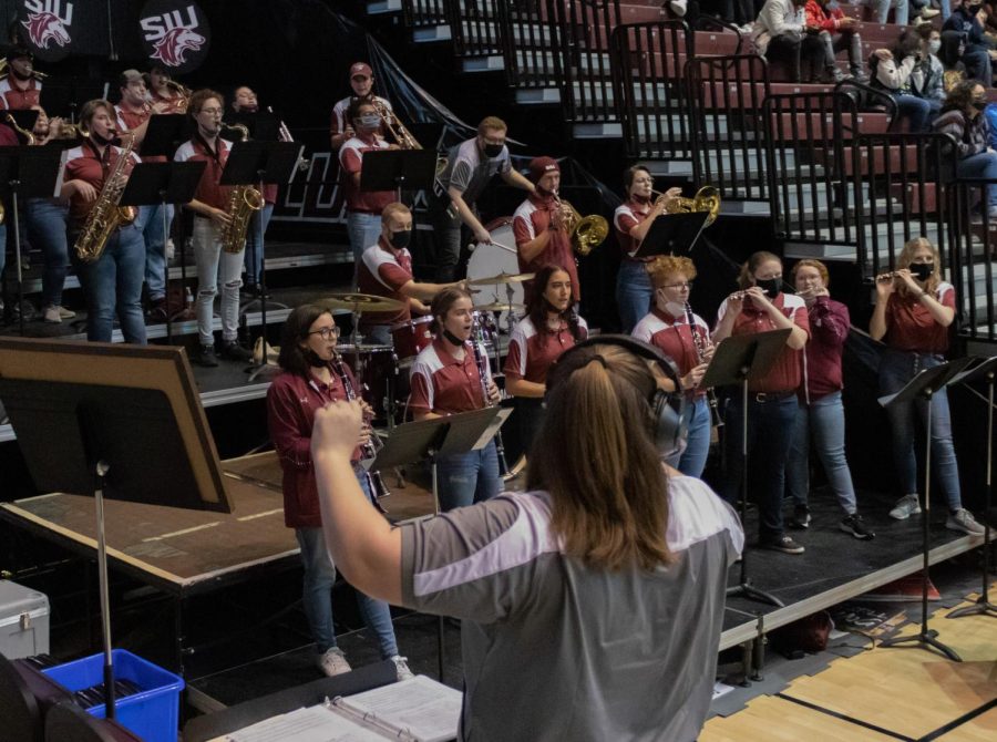 SIU graduate student, Rachelle Bartleman, directs the SIU Pep Band at the Dawg Pound Maroon Madness Pep Rally Jan. 13, 2022 at the Banterra Center in Carbondale, Ill.

