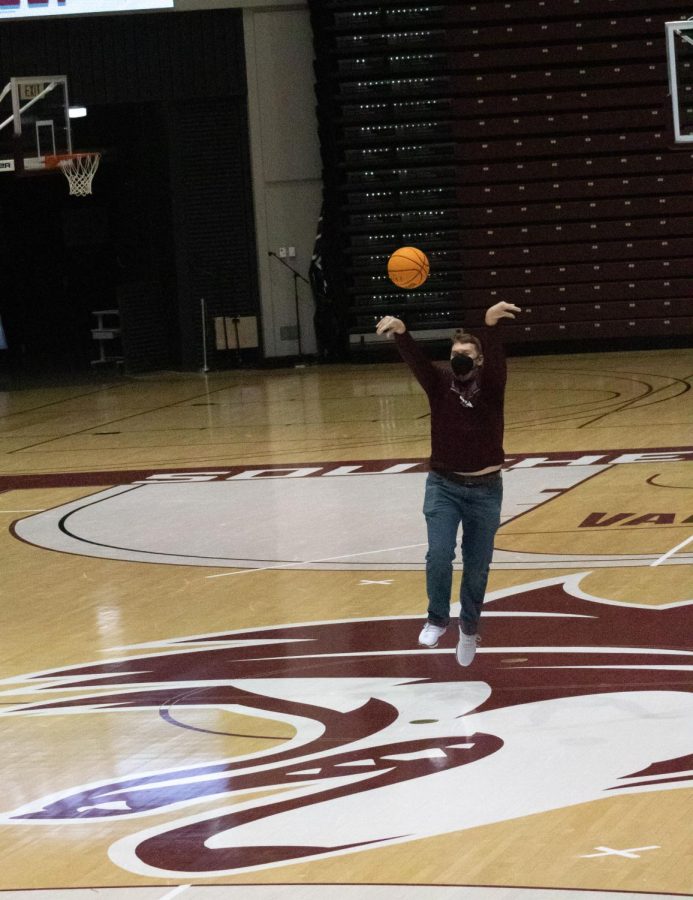 A student participant shoots a basketball during a game at the Dawg Pound Maroon Madness Pep Rally Jan. 13, 2022 at the Banterra Center in Carbondale, Ill. 
