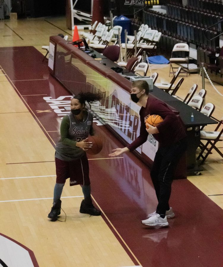 A student grabs a basketball during a game against another student at the Dawg Pound Maroon Madness Pep Rally Jan. 13, 2022 at the Banterra Center in Carbondale, Ill. 
