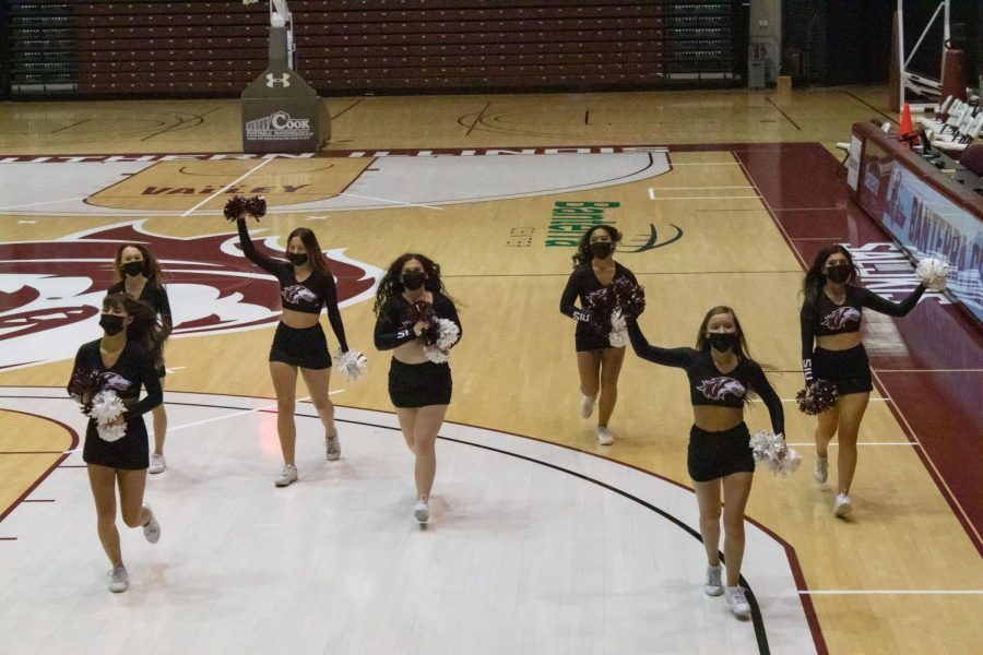 The SIU Spirit Squad exits the court as games and activities commence at the Dawg Pound Maroon Madness Pep Rally Jan. 13, 2022 at the Banterra Center in Carbondale, Ill. 
