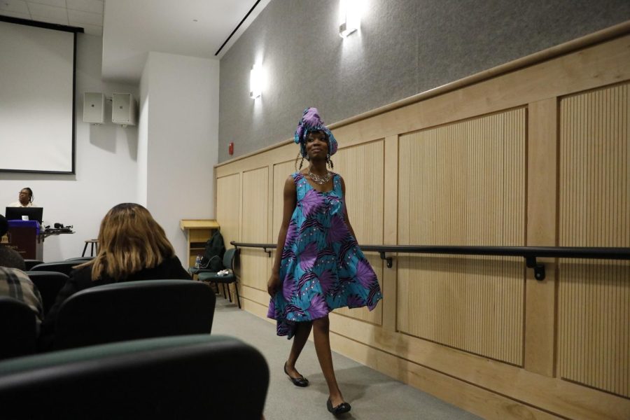 Janelle Thompson struts down the aisle as she models her African American inspired clothing during the Afro-Centric Fashion Show on Feb. 27, 2022 at the Guyon Auditorium in Morris Library in Carbondale, Ill. This event was held by SIU’s Black Resource Center and Carbondale’s National Association for the Advancement of Colored People in honor of Black History Month.
