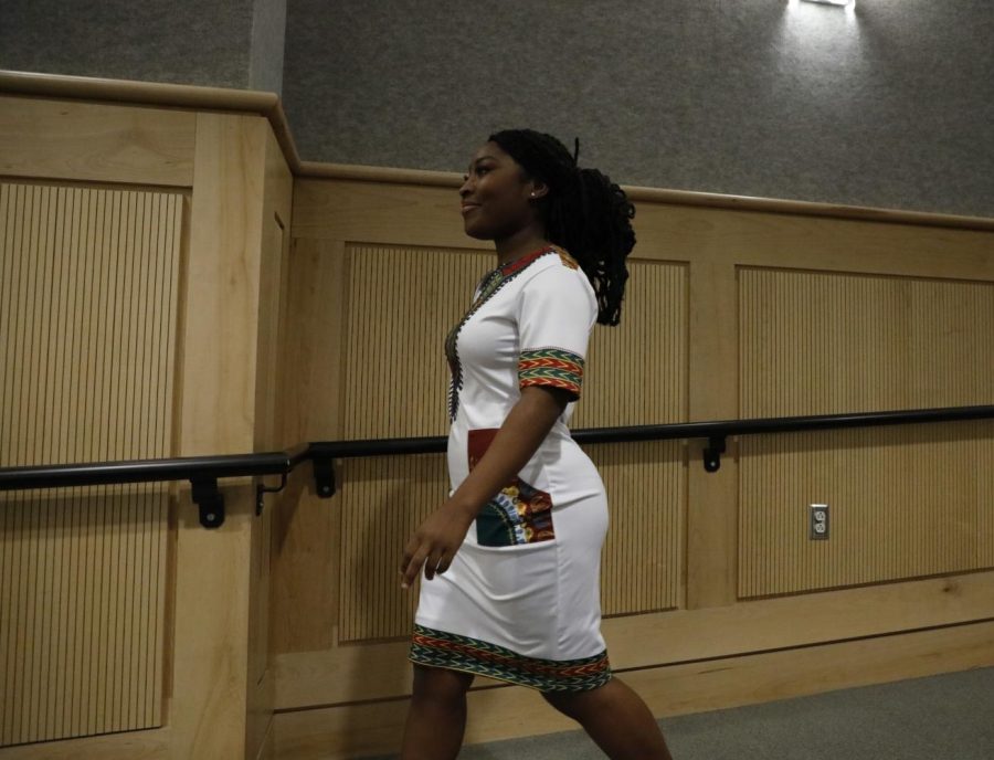 A model makes her way to the front of the room while wearing an African American inspired dress during the Afrocentric Fashion Show on Feb. 27, 2022 in the Guyon auditorium in Carbondale, Ill.
