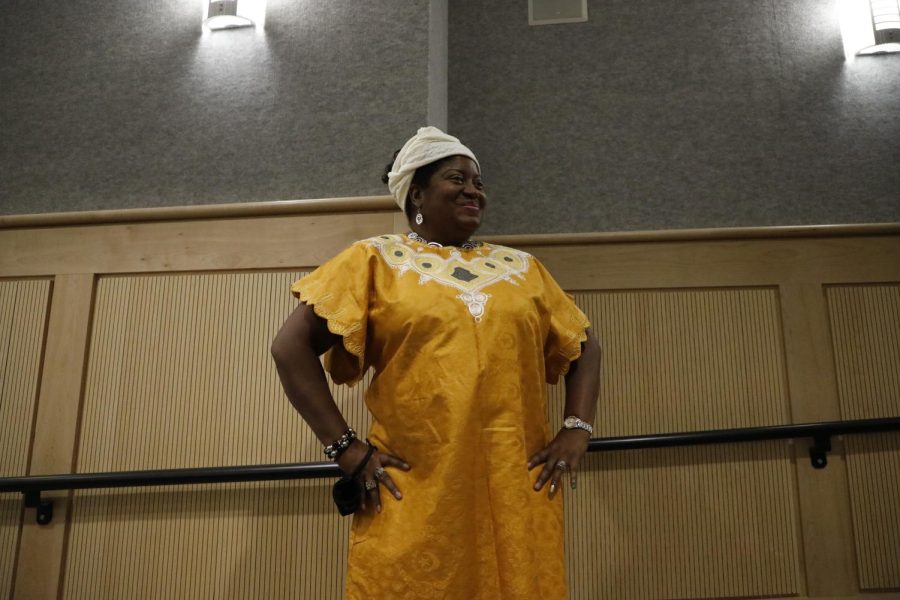 Sharon Simon poses towards the audience during the Afro-Centric Fashion Show on Feb. 27, 2022 at Morris Library in Carbondale, Ill.
