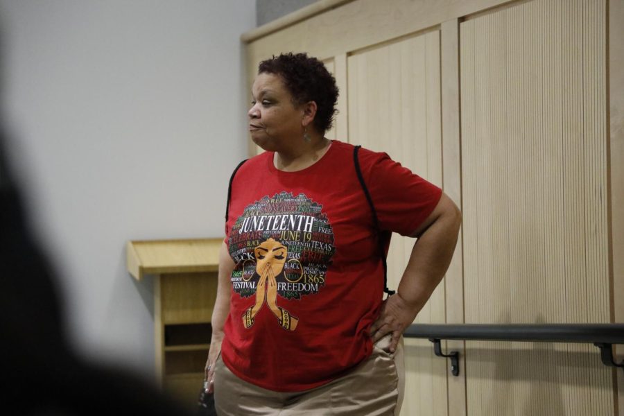 Ernestine Hughlett poses while wearing their Juneteenth attire during the Afro-Centric Fashion Show on Feb. 27, 2022 in Guyron Auditorium in Carbondale, Ill.
