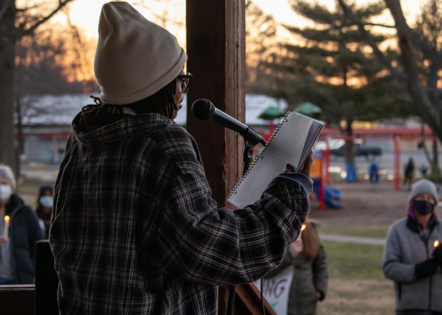 Adah Mays, a senior at Carbondale Community High School, reads her poem “Amir’s Story” at a protest honoring his memory and speaking out against no-knock warrants Feb. 27, 2022 at Turley Park in Carbondale, Ill. 
