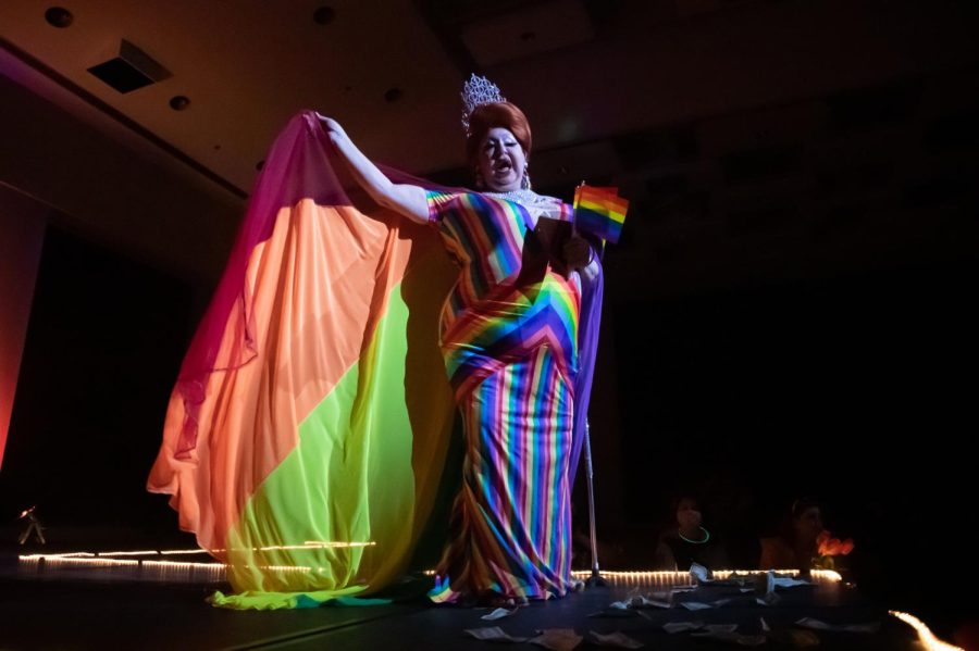 Blanche DuBois holds up a pride flag cape at the Spicy Seventies Disco Drag Show, sponsored by the Saluki Rainbow Network and the Office of Student Engagement, Feb. 19, 2022 at the SIU Student Center in Carbondale, Ill. 