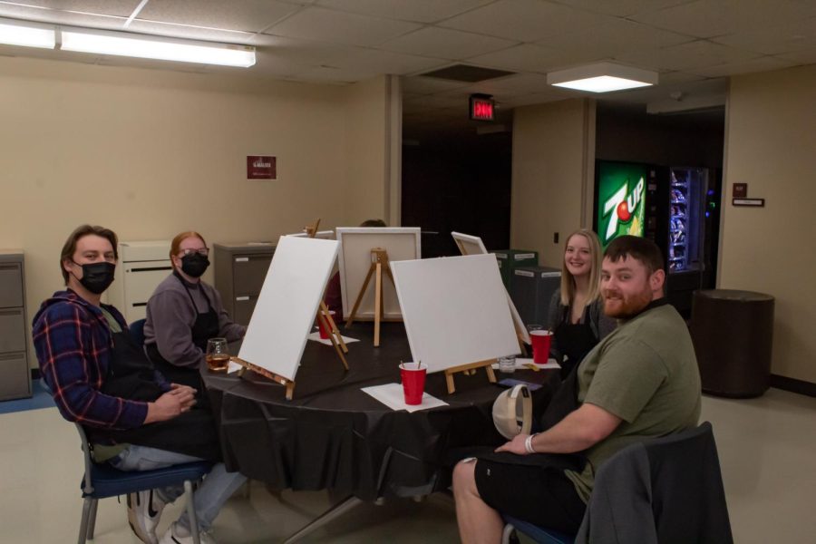 SIU law students pose for a photo at the Project Human X paint night Feb. 19, 2022 at the SIU Law School in Carbondale, Ill. 