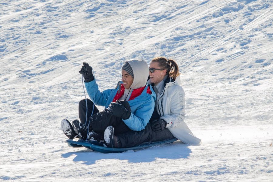Two sledders zoom down a hill at the Banterra Center Feb. 4, 2022 in Carbondale, Ill. 