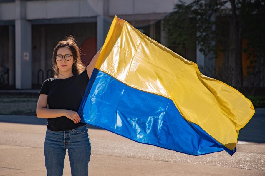 Diana Butsko, a Ukrainian SIU student, holds a Ukrainian flag March 2, 2022 in Carbondale, Ill. 