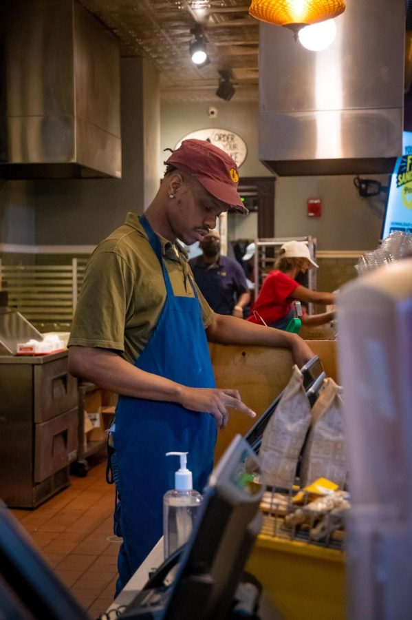 Isaiah Hammonds serves a customer during his shift at Potbelly Sandwich Shop March 18, 2022 on Michigan Avenue in Chicago, Ill.