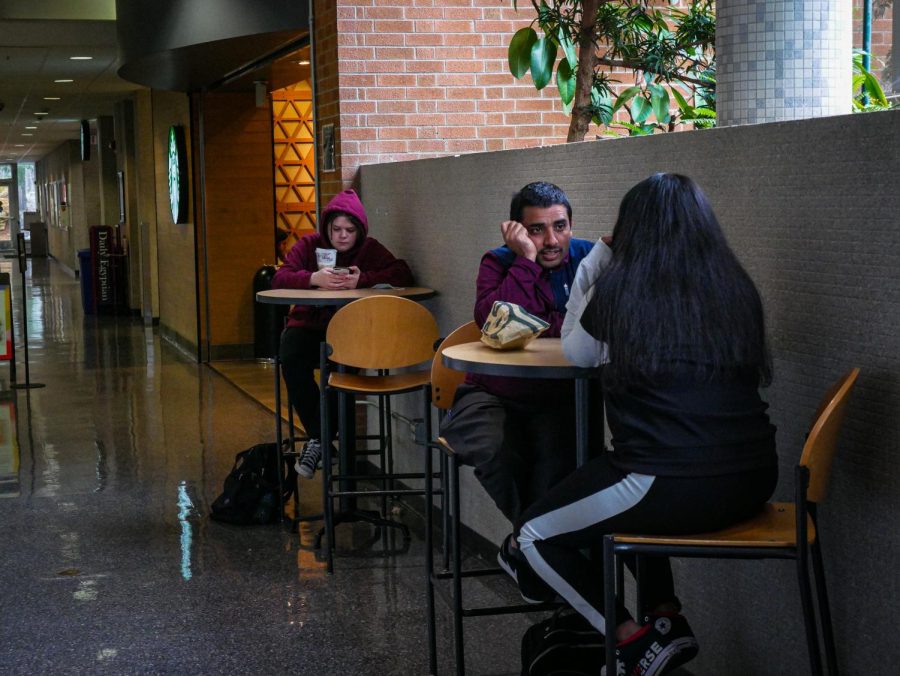 Students chat near Starbucks at the SIU Student Center March 28, 2022 in Carbondale, Ill. 