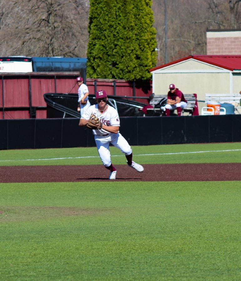 SIU infielder fields a ball April 3, 2022 at the Itchy Jones Stadium in Carbondale, Ill. 
