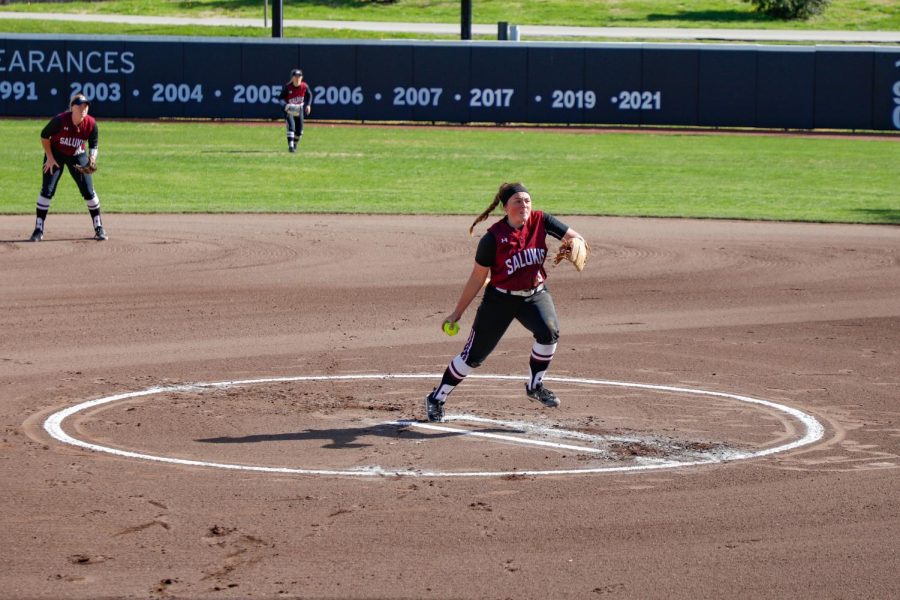 SIU sophomore, Madi Eberle, winds up a pitch to the Saint Louis Billikens on Wednesday, April 6, 2022 at Charlotte West Stadium in Carbondale, Ill. 