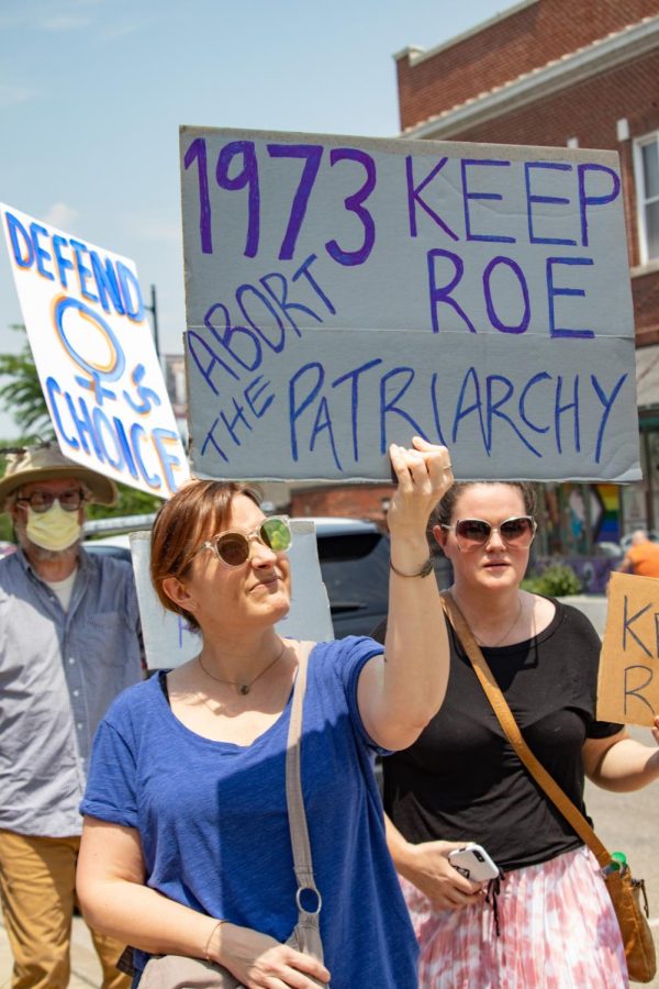 A woman holds a sign that says, 1973 Keep Roe Abort The Patriarchy at the Bans Off Our Bodies March May 14, 2022 in Carbondale, Ill. 