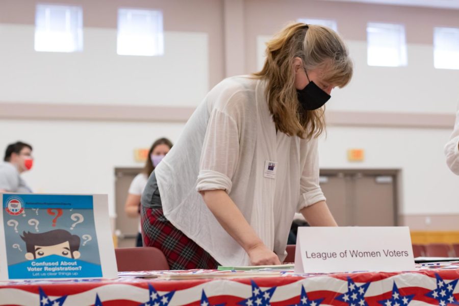 Laura Van Abbema sets out flyers and informational papers at the League of Women Voters table during the Bans Off Our Bodies March May 14, 2022 in Carbondale, Ill. 