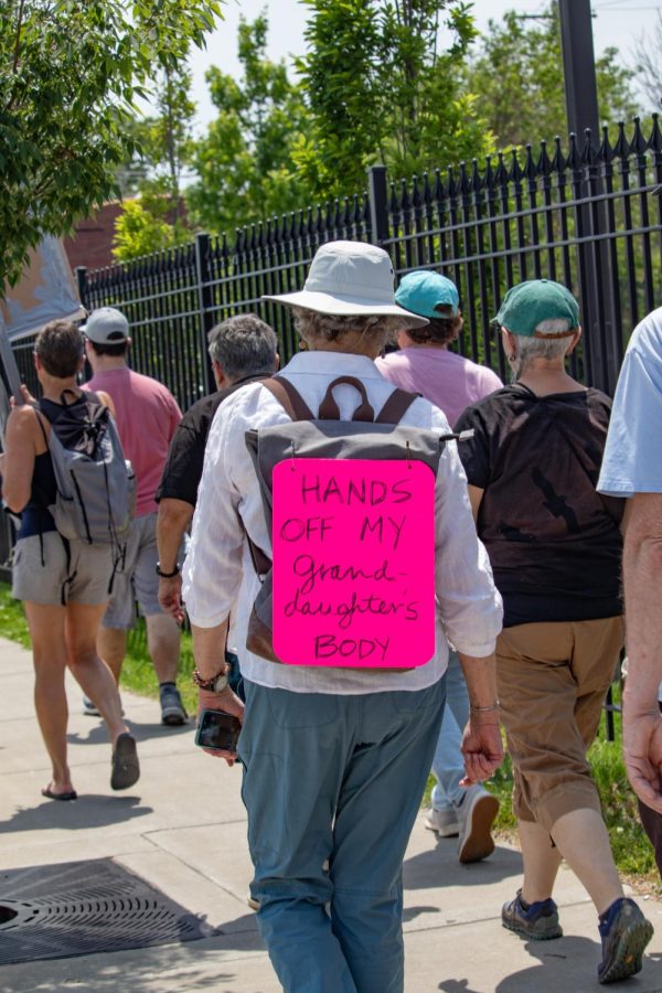 A protestor participates in the Bans Off Our Bodies March with a sign reading, Hands Off My Granddaughters Body, May 14, 2022 in Carbondale, Ill. 