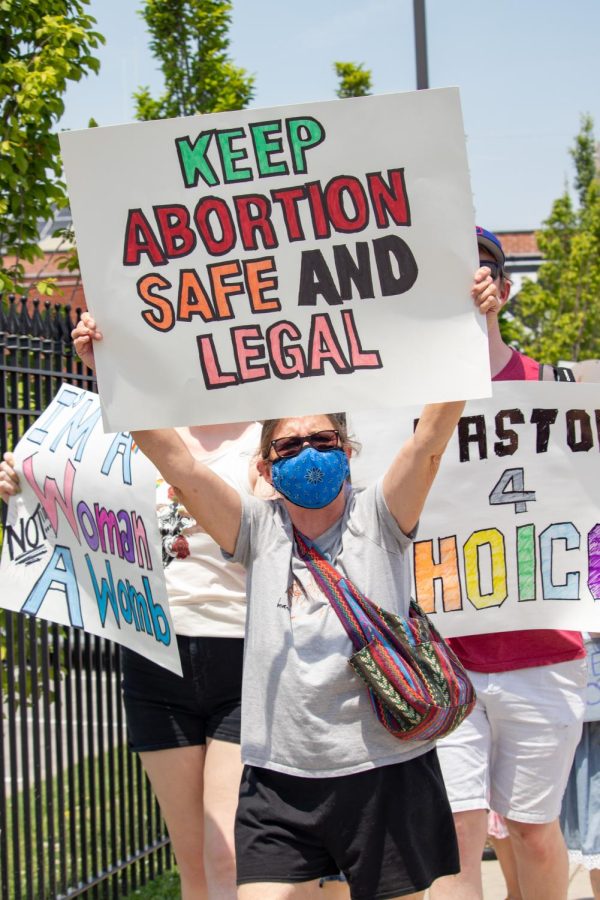 A protestor holds a sign at the Bans Off Our Bodies March May 14, 2022 in Carbondale, Ill. 