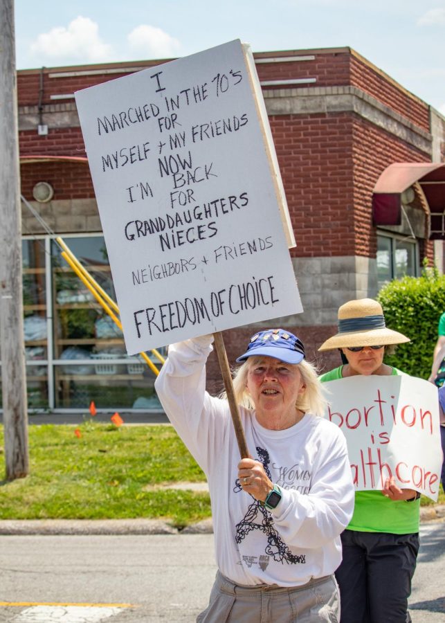 A woman holds a sign that says, I marched in the 70s for myself and my friends. Now Im back for granddaughters, nieces, neighbors and friends. Freedom of choice, during the Bans Off Our Bodies March May 14, 2022 in Carbondale, Ill. 