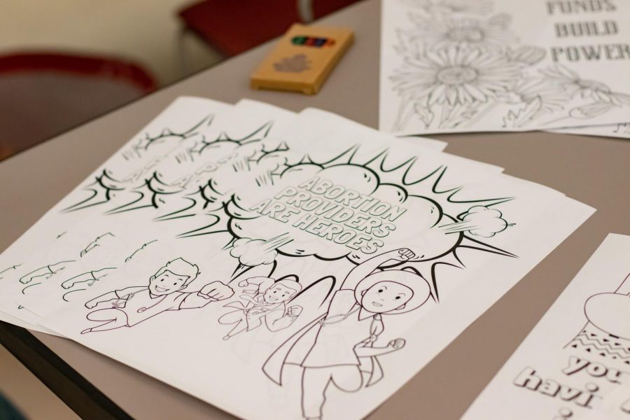 Coloring pages and posters sit on a table for children at the Bans Off Our Bodies March May 14, 2022 in Carbondale, Ill. 