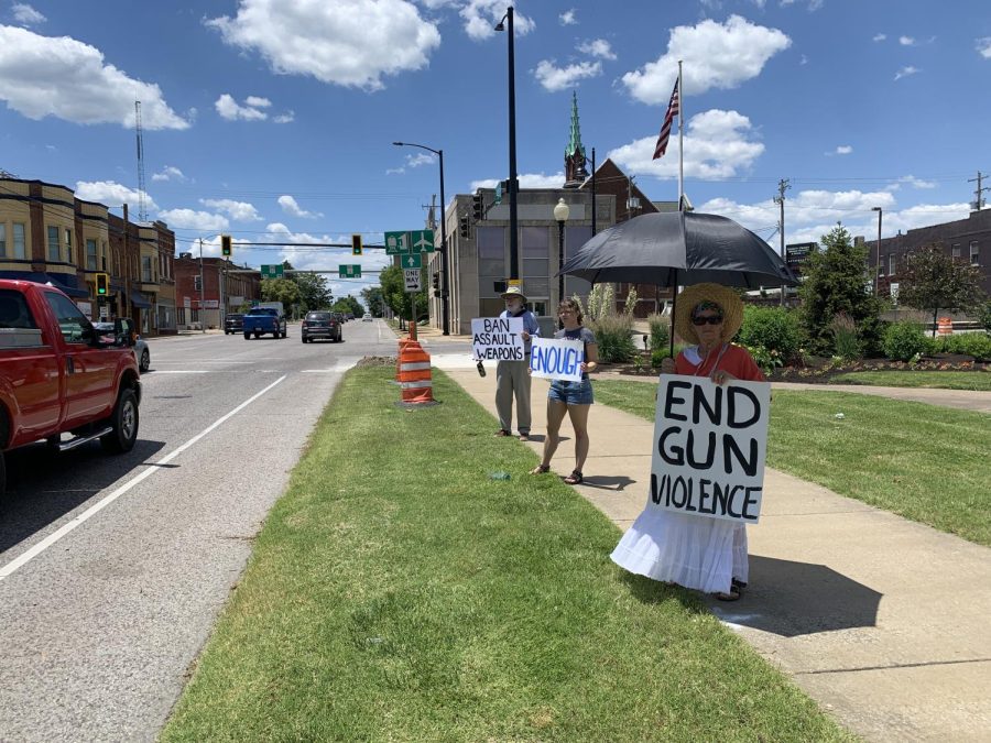 Protestors hold signs against gun violence June 4, 2022 in Carbondale, Ill. 