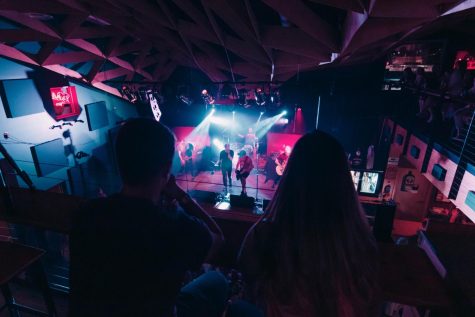 File Photo: Concert attendees sit and drink as Isabella plays their metal music on the stage below July 23, 2022 at Hangar 9 in Carbondale, Illinois.