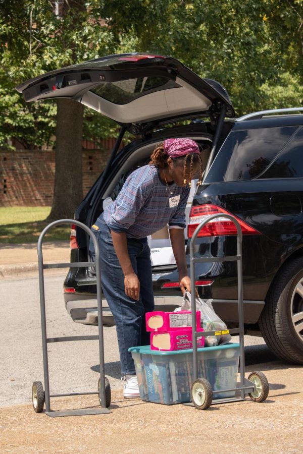 Toki Fijabi, a first year student at SIU, moves her belongings into her dorm Aug. 19, 2022 in Carbondale, Ill. 